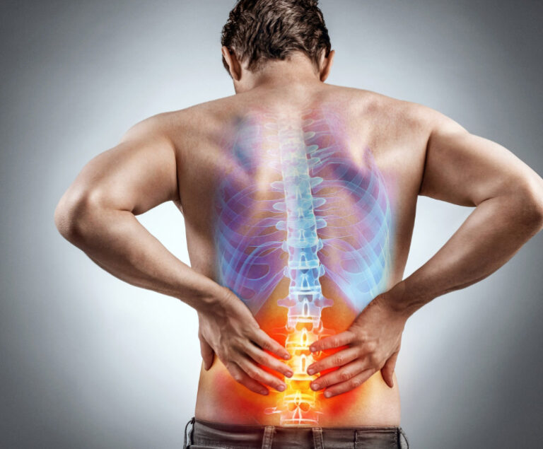 Man holding his lower back in pain